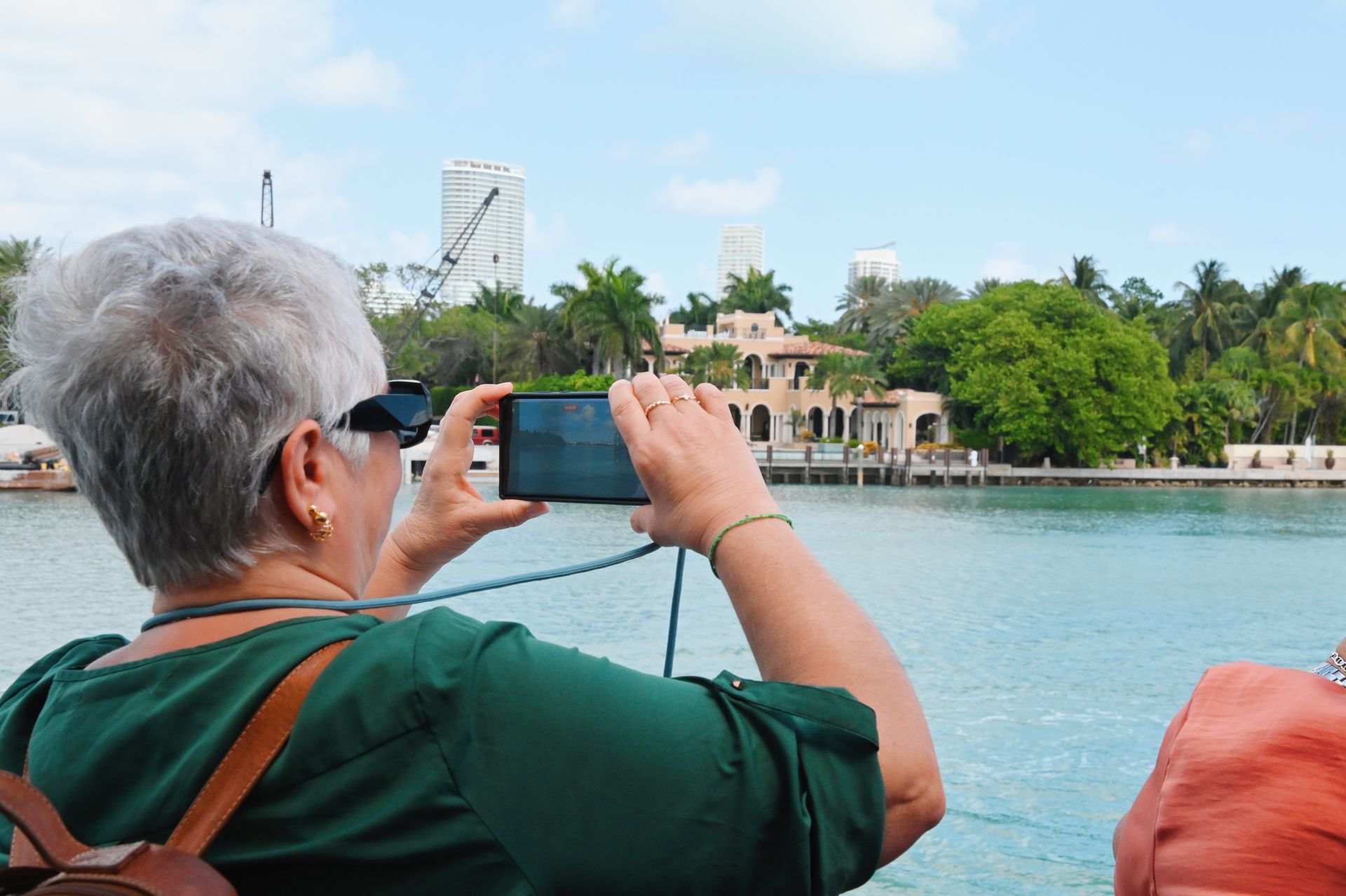 Passenger taking photos of the Mansions on Star island