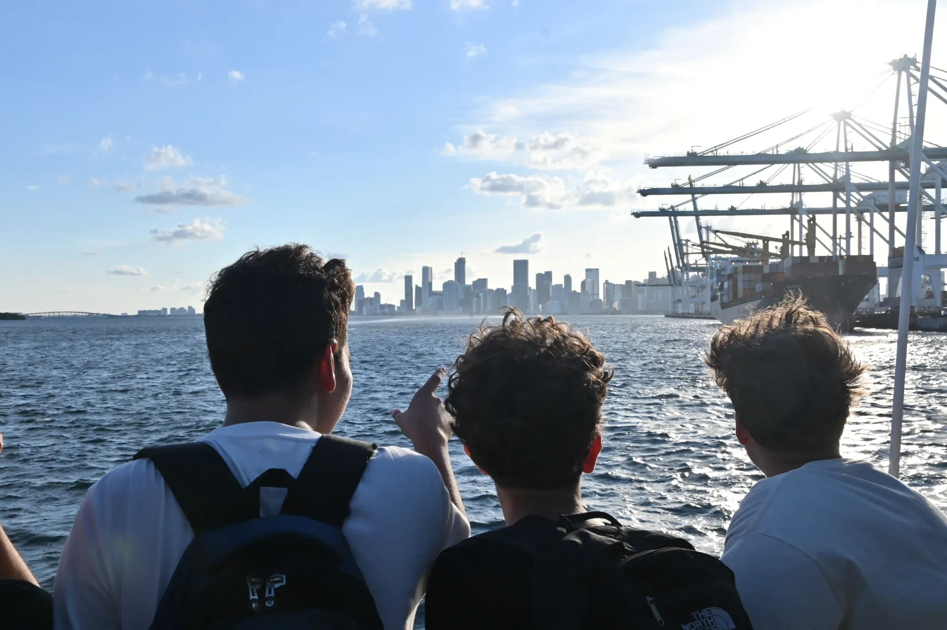 Guests enjoying views of PortMiami and the Miami skyline during a sightseeing route on Biscayne Bay.