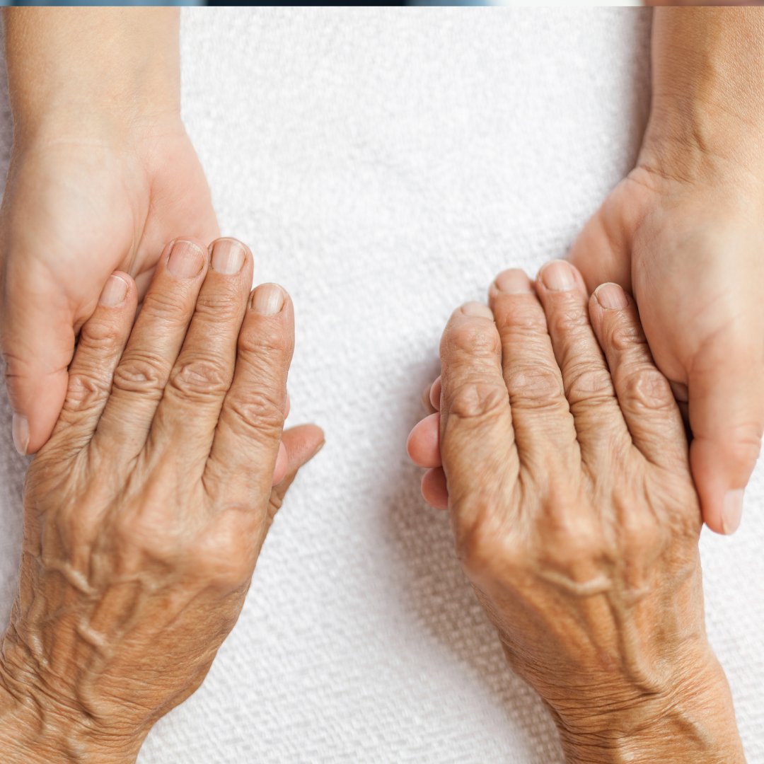 Nurse putting a shawl on the old lady