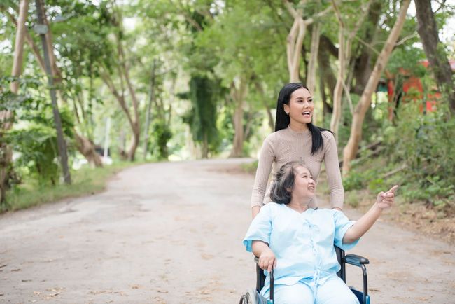 senior and young nurse on a walk