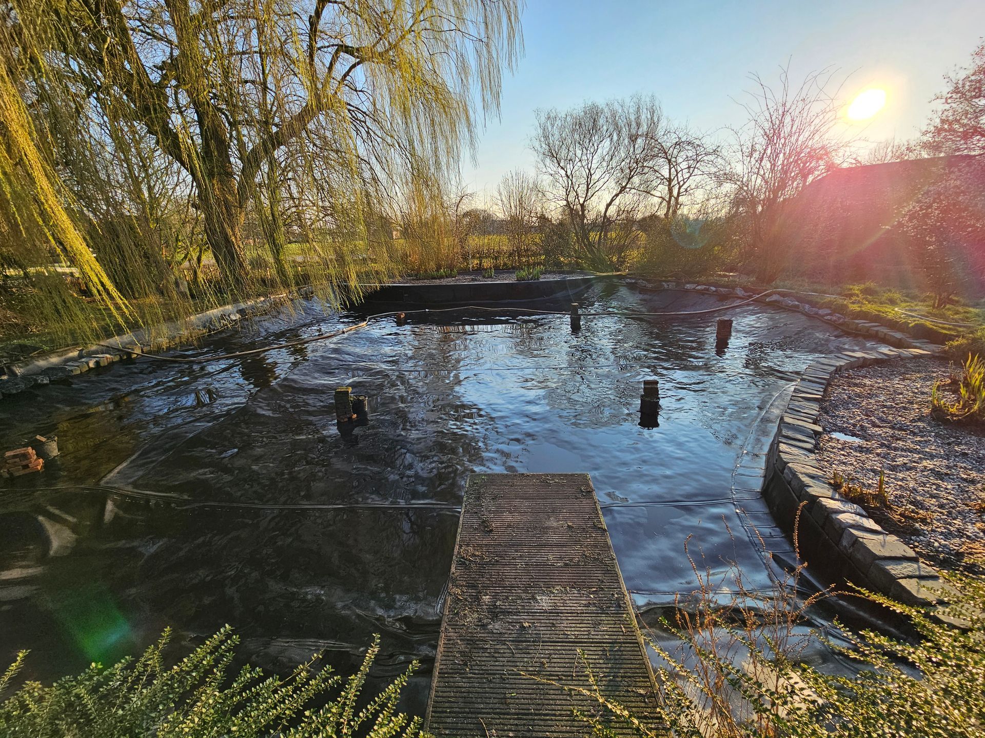 Schlamm entfernen Gartenteich