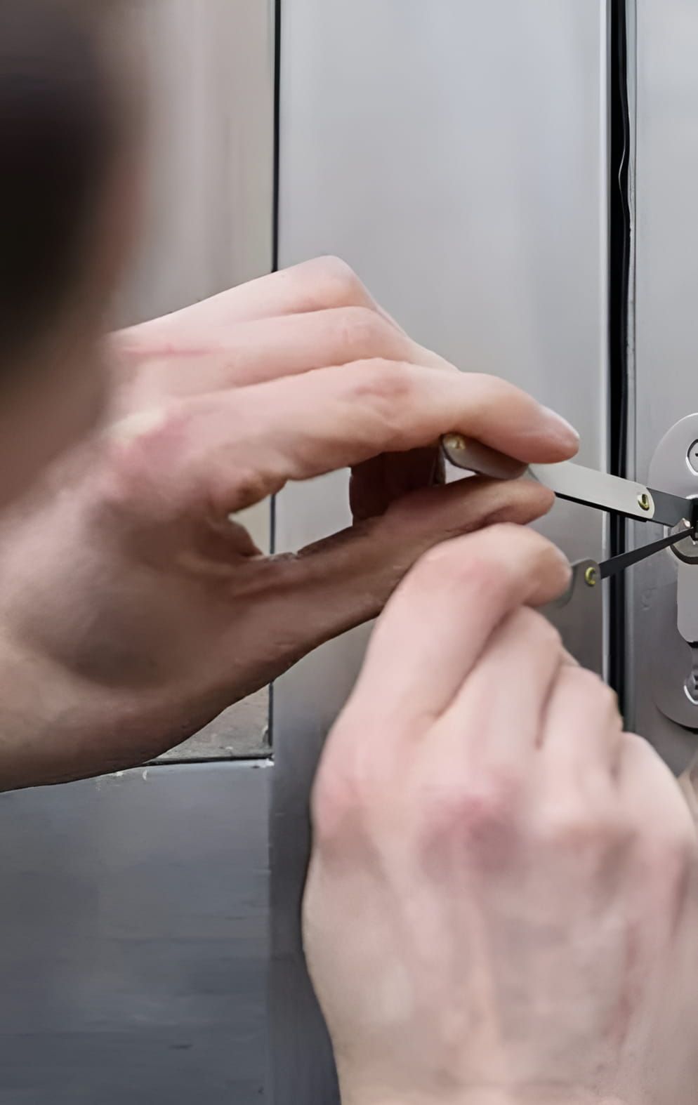 A Person is Using a Key to Open a Door — Coast & Hinterland Mobile Locksmiths In Peregian, QLD