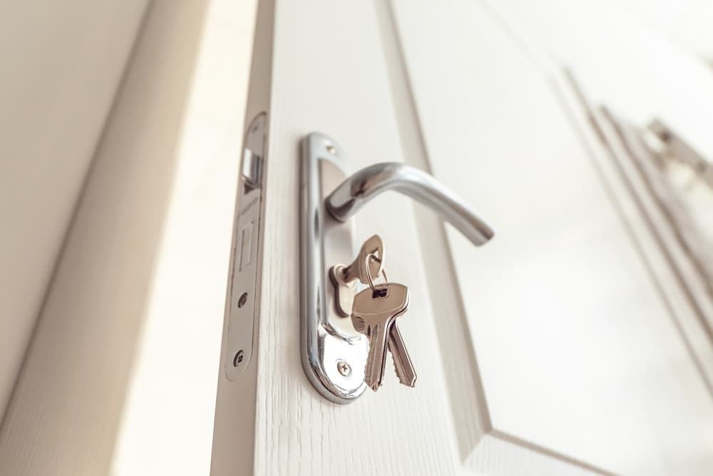 A Close Up of a Door With Keys in It — Coast & Hinterland Mobile Locksmiths In Noosaville, QLD