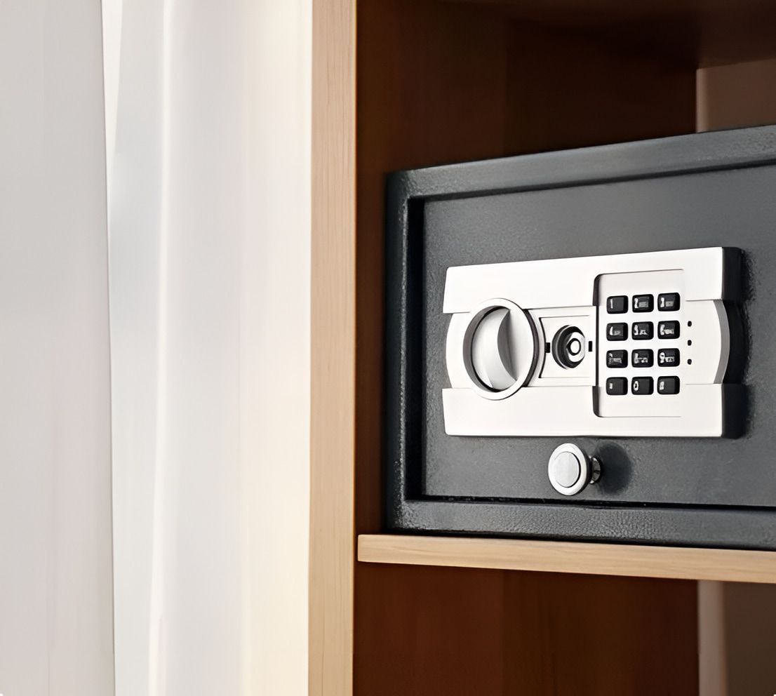 A Digital Safe is Sitting on Top of a Wooden Shelf — Coast & Hinterland Mobile Locksmiths In Noosaville, QLD