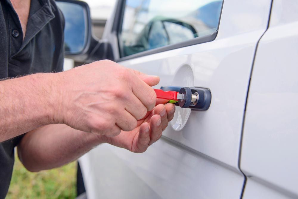 Automotive Locksmith In Noosa Working On A White Vehicle