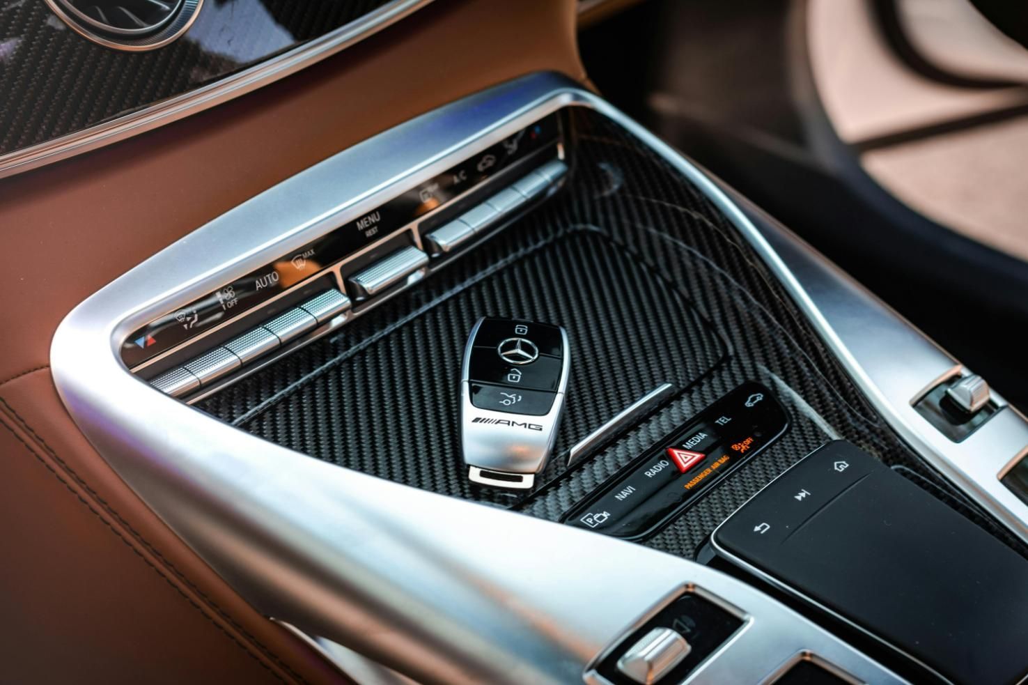 A Car Key Is Sitting in The Center Console of A Car — Coast & Hinterland Mobile Locksmiths In Noosaville, QLD