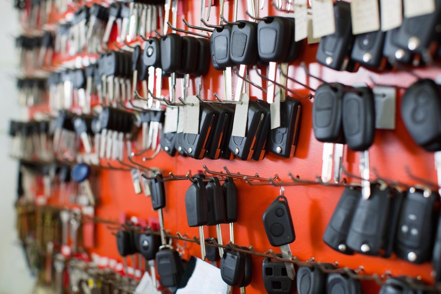 A Bunch of Car Keys Are Hanging on A Wall — Coast & Hinterland Mobile Locksmiths In Noosaville, QLD