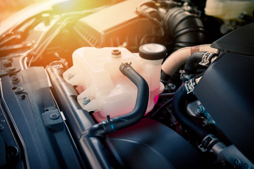 Car Engine Compartment; Coolant Reservoir Visible — CE Automotive Service Centre in Garbutt, QLD