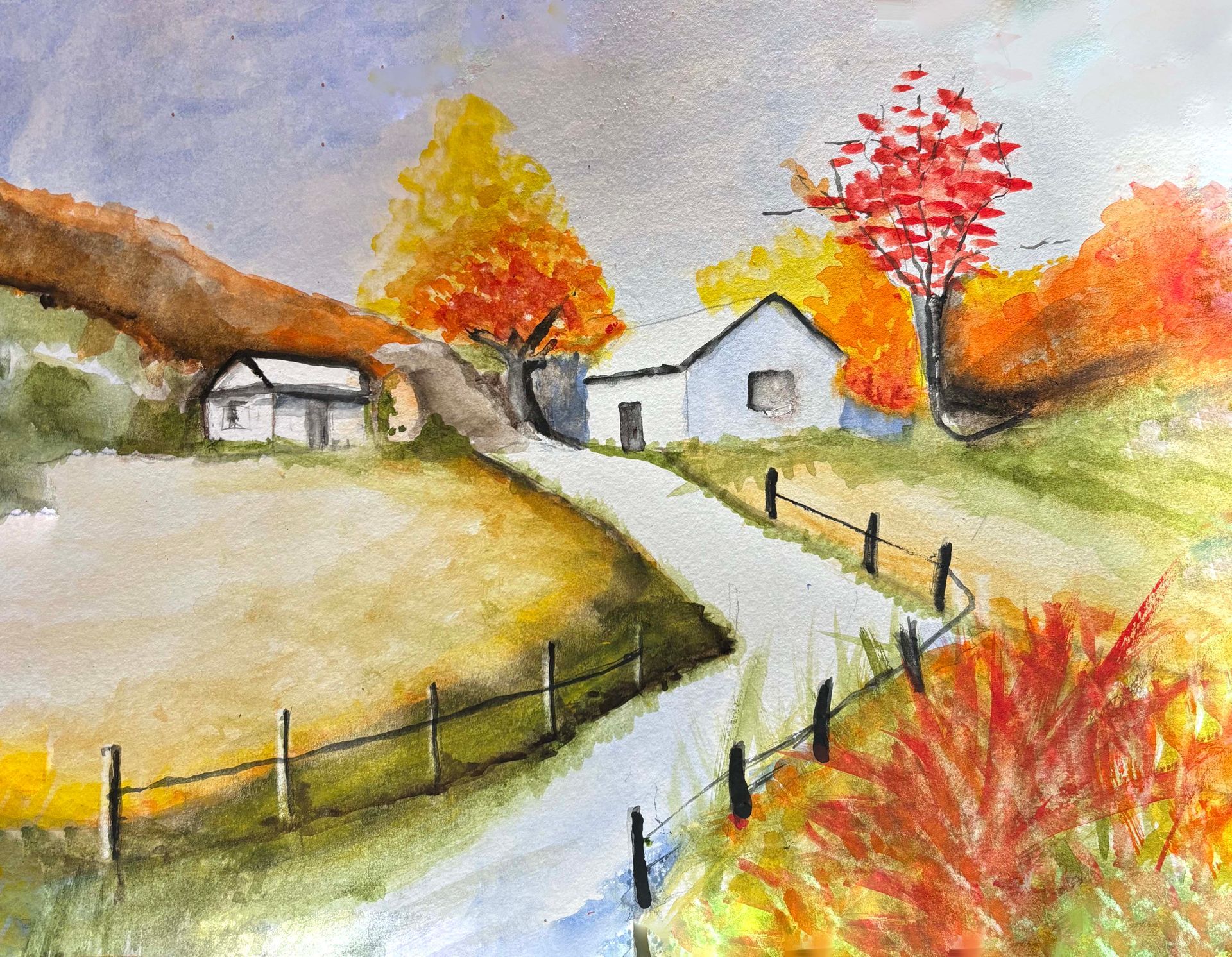 Autumn countryside with a winding path, white cottages, and trees in red, orange, and yellow foliage.