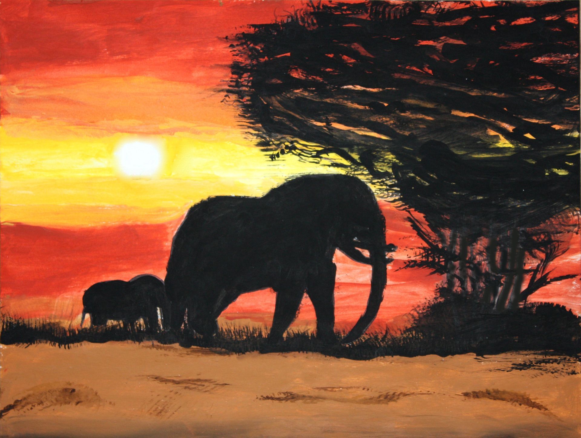 Elephants silhouetted at sunset in an orange savanna, with a large tree on the right