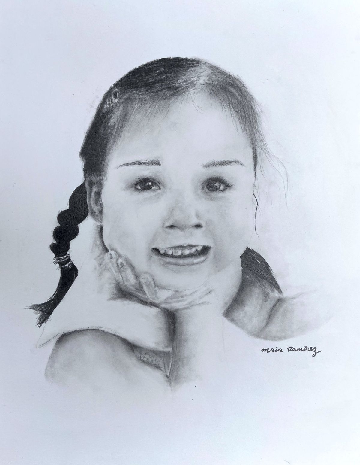 Pencil sketch of a smiling child resting their chin on their hands.