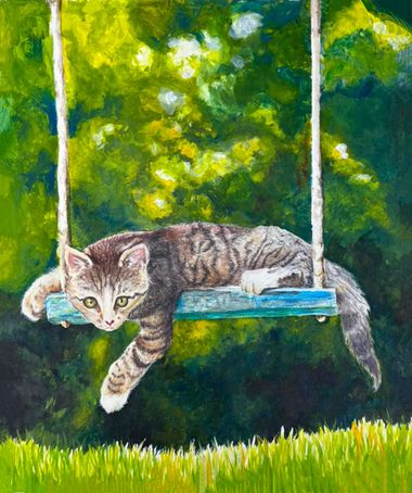 Gray tabby cat lounging on a blue swing in a sunny green garden