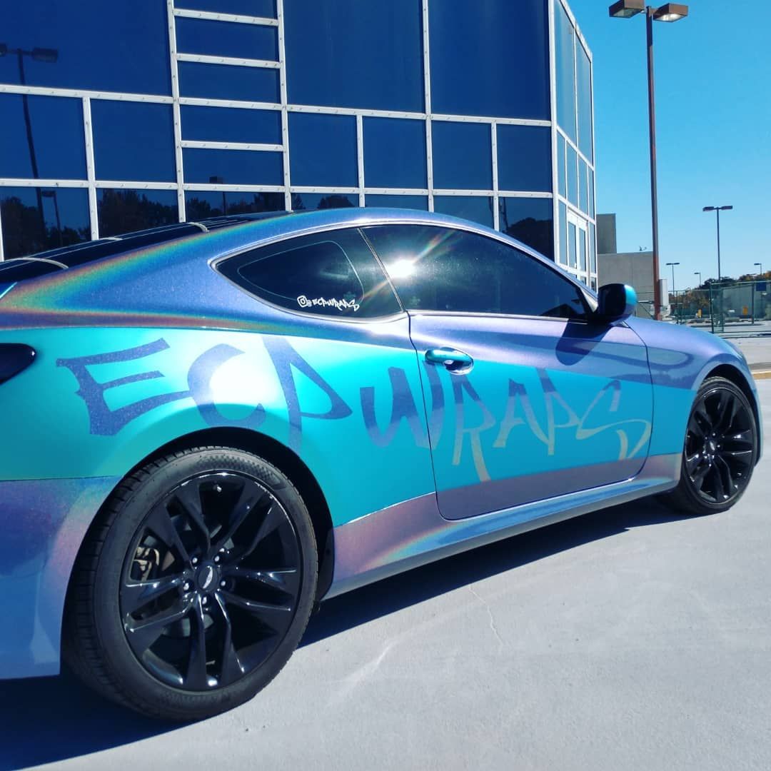 Blue iridescent car with black wheels and 