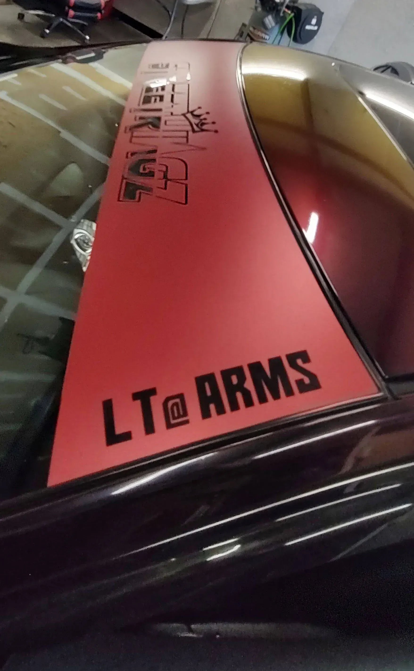 Red car panel with black text 