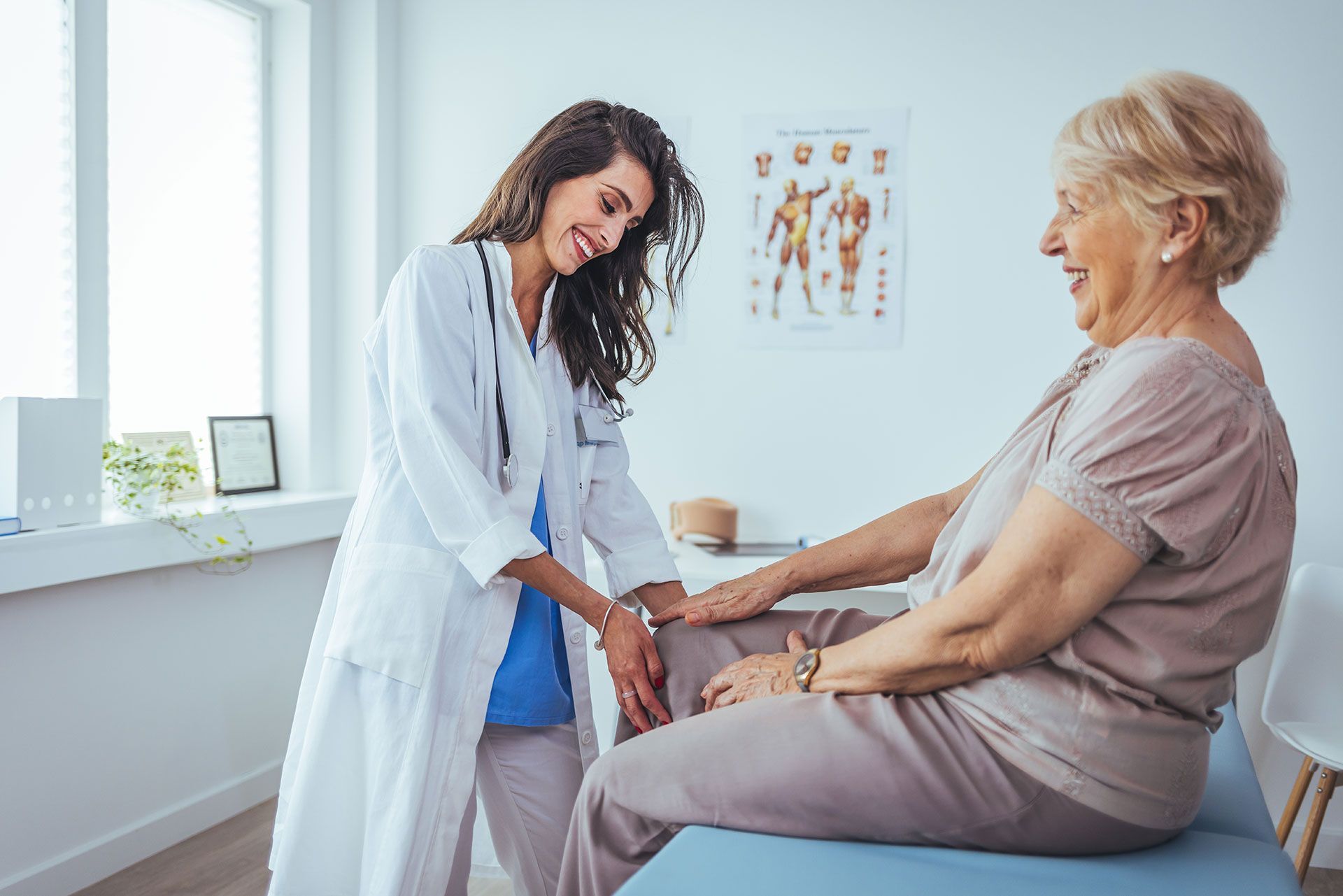 A doctor is talking to a patient while holding a clipboard.