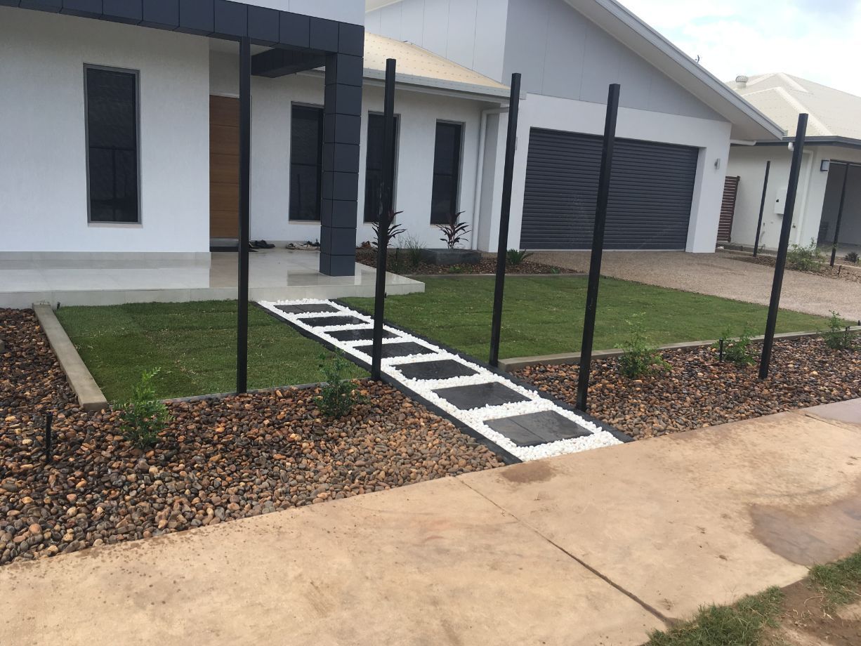 A House with A Driveway and A Fence in Front of It — Green Vision NT in Virginia, NT