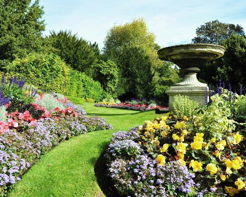 A Garden with Flowers and A Fountain in The Middle — Green Vision NT in Durack Heights, NT