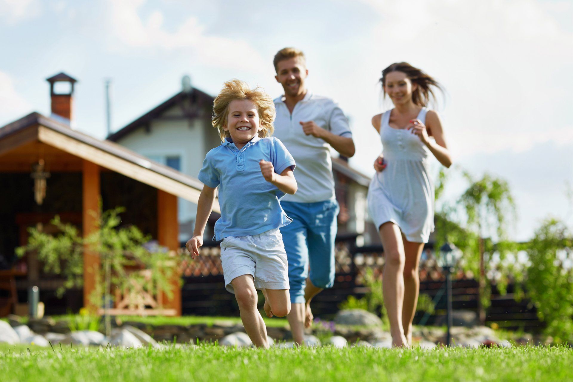 Family Playing in Their Garden