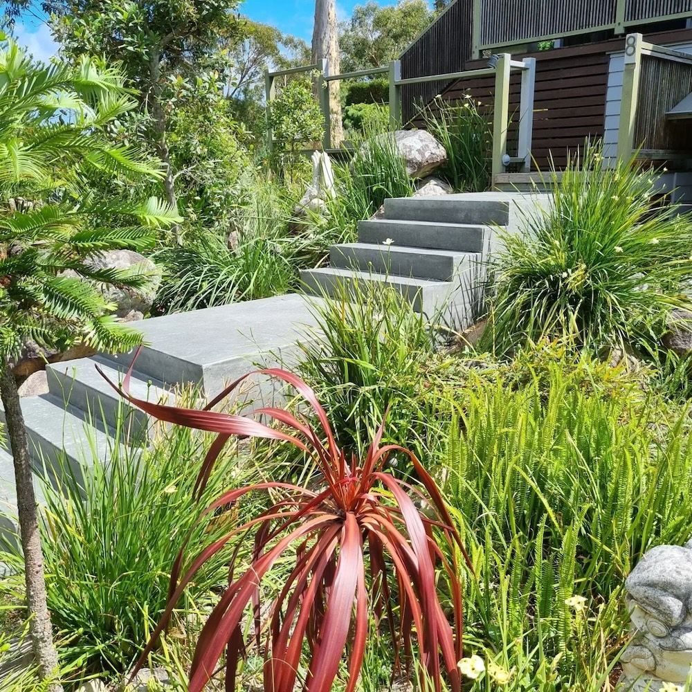 A Garden With Stairs And Plants In Front Of A House — Dave Smith Concrete in Salt Ash, NSW