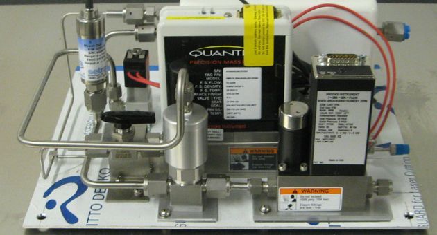 A quantum device is sitting on top of a white board