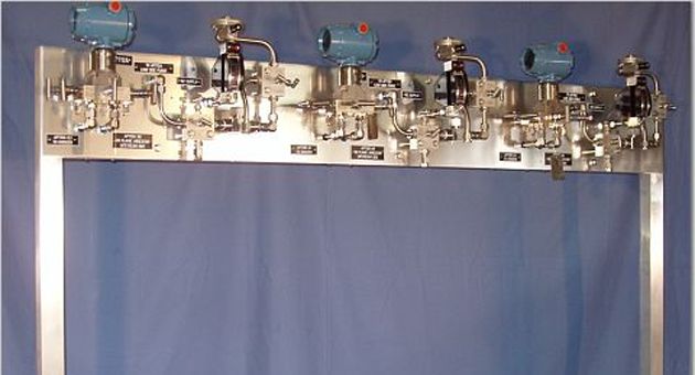 A stainless steel frame with a bunch of valves on it
