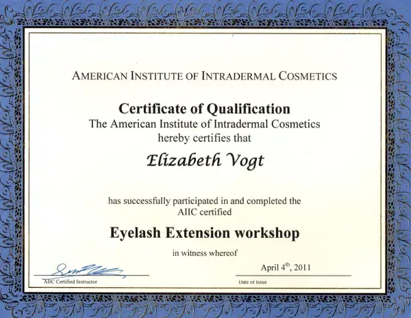 A certificate of qualification from the American Institute of Intradermal Cosmetics awarded to Elizabeth Vogt in 2011.