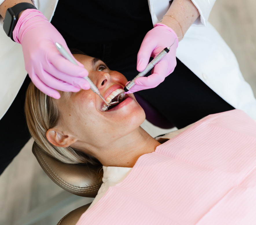 Dr. Alexandra Coleman performing a dental exam in Milton, GA office