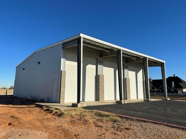 A large white building with a blue sky in the background