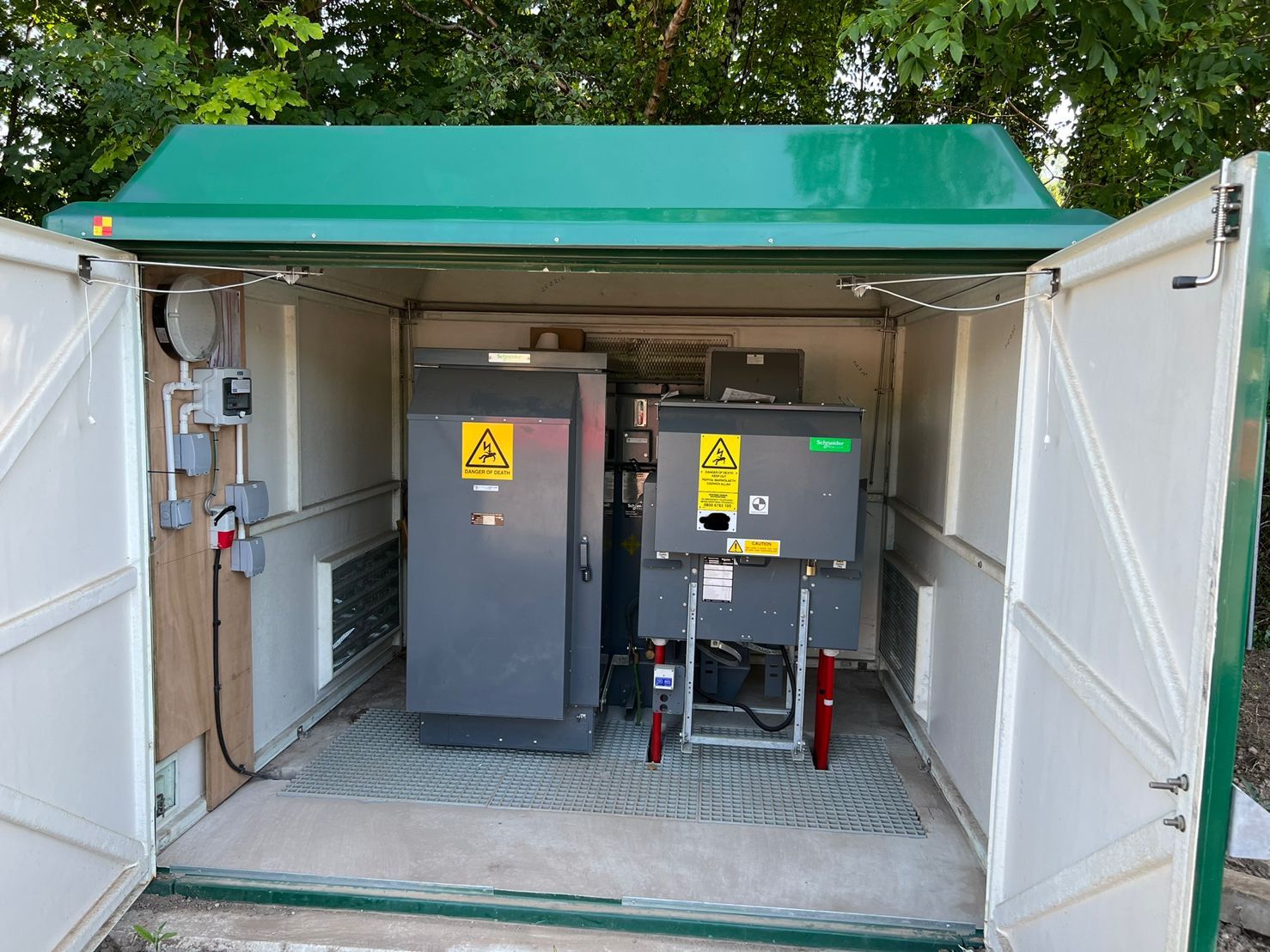 DP Cable Jointing | A green and white building with a lot of electrical equipment inside of it