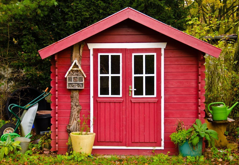 Red Garden Shed With White-trimmed Double Doors — Ericson Constructions in Mareeba, QLD
