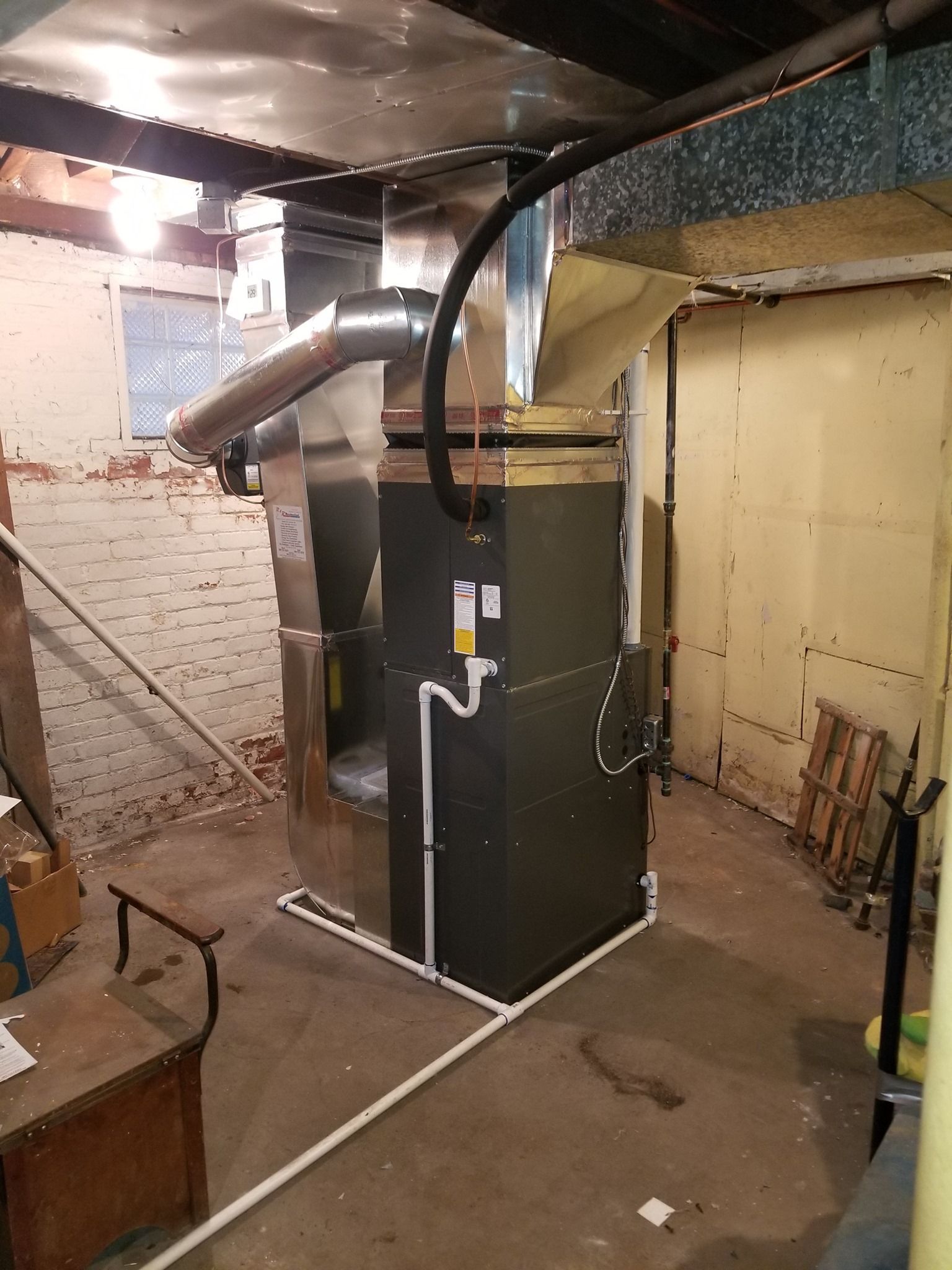 there is a heater in the corner of the room .