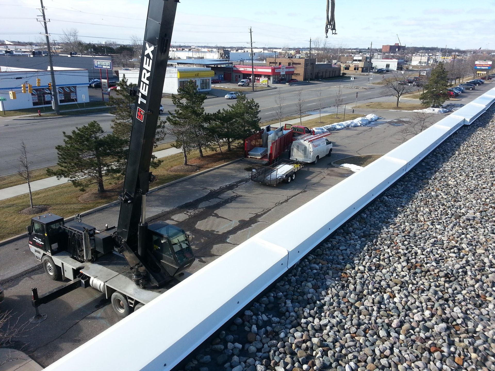 a terex truck is parked on the side of the road