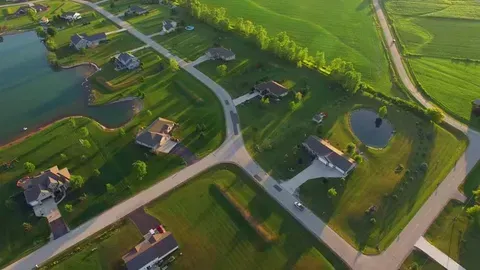 An aerial view of a residential area with lots of houses and roads.