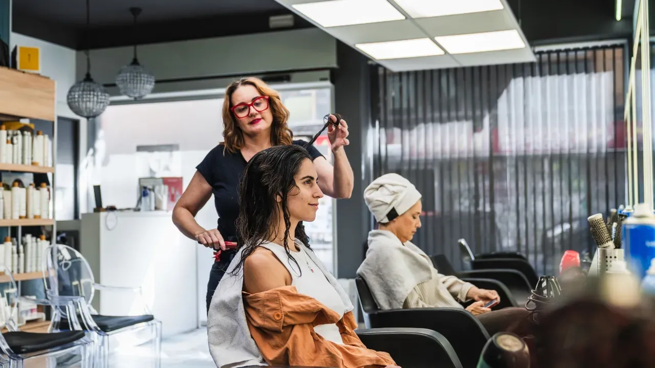 young woman getting her hair done in a hair salon