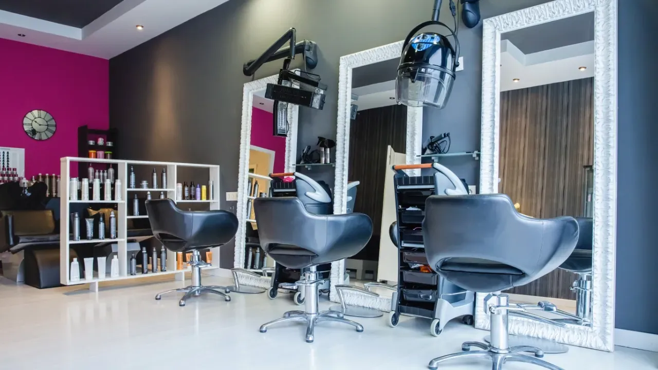 view of a hair salon with large wall mirrors