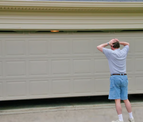 Homeowner with a garage door stuck half open needing repair in Sydney