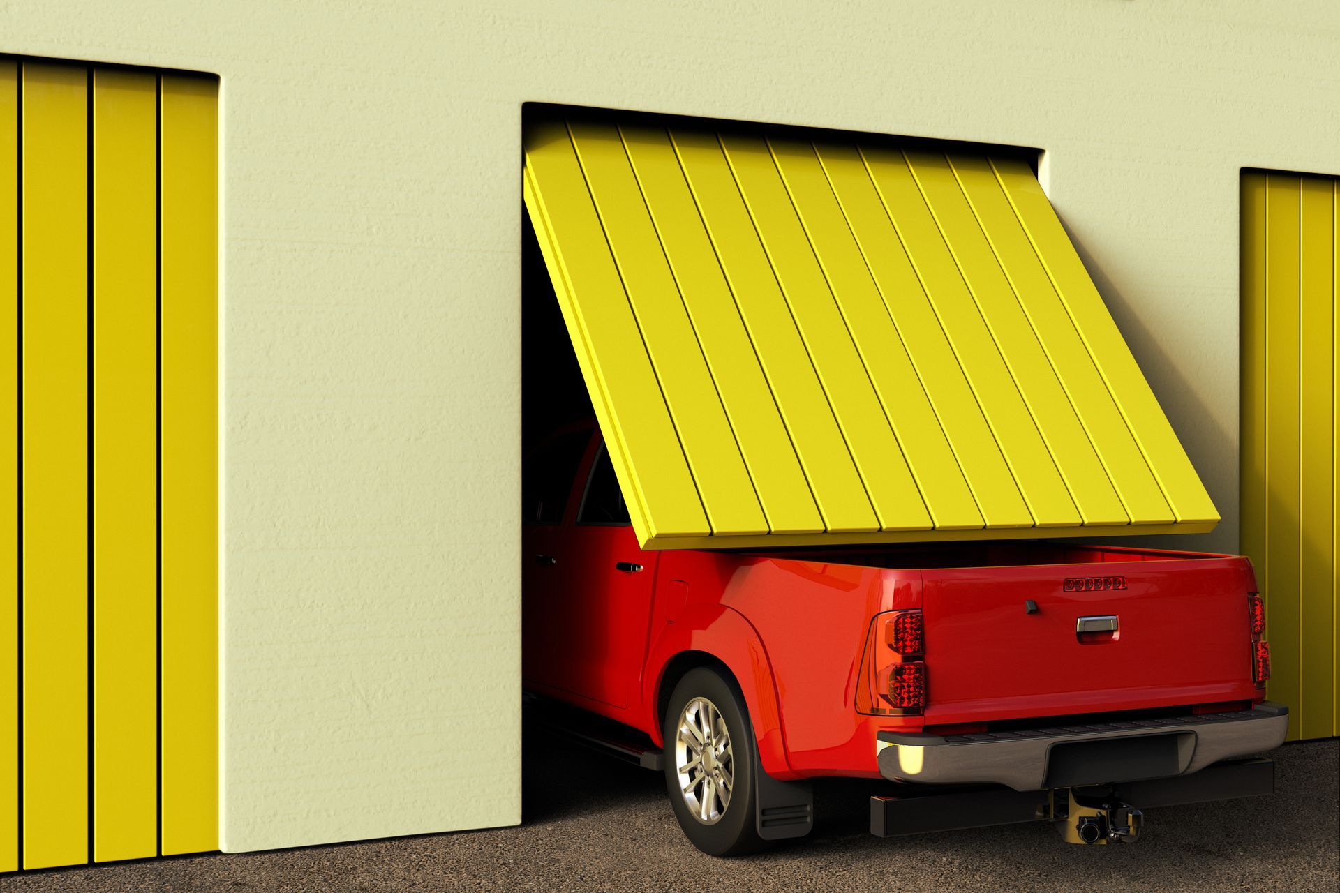 Red pickup truck parked in a garage with a yellow roll-up door partly open.