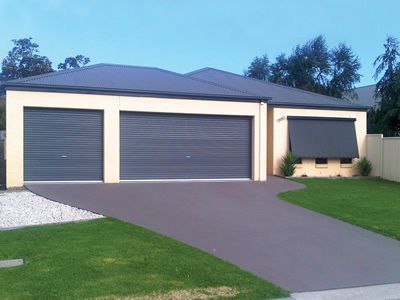 Two new grey garage doors installed on a North Shore home