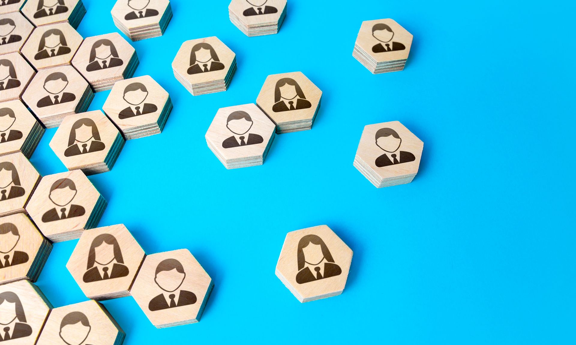 Hexagonal tokens with profile icons scattered on a bright blue background
