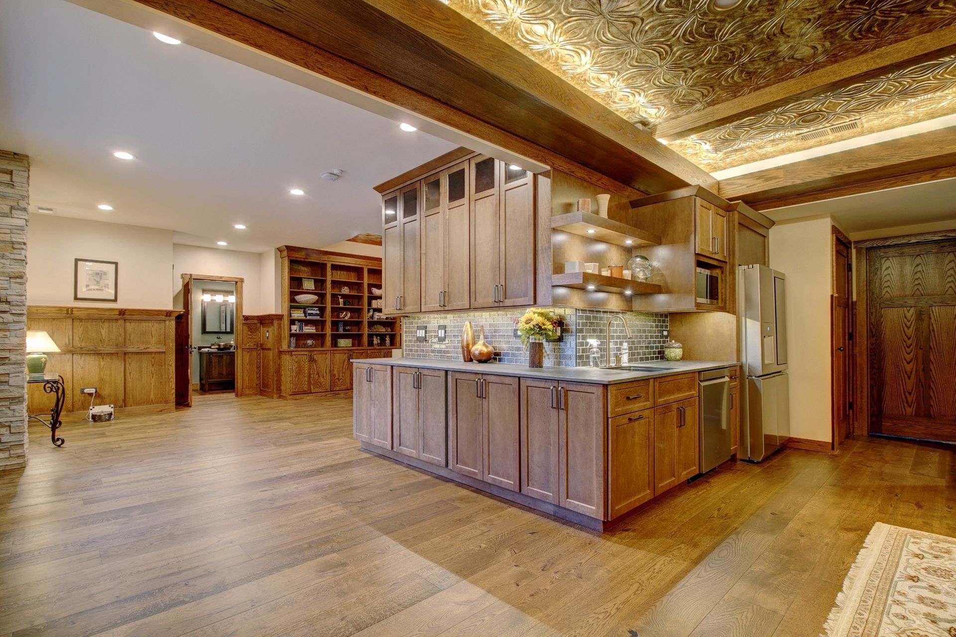 A kitchen with wooden cabinets and stainless steel appliances