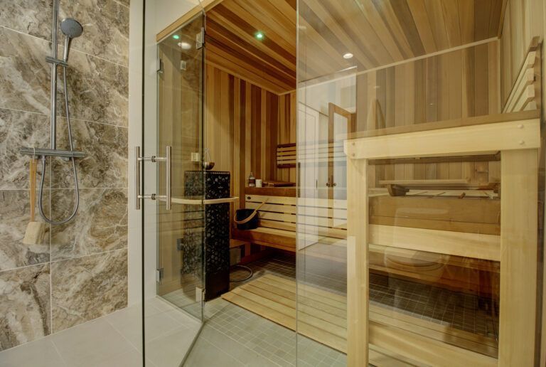 A bathroom with a sauna and a shower.