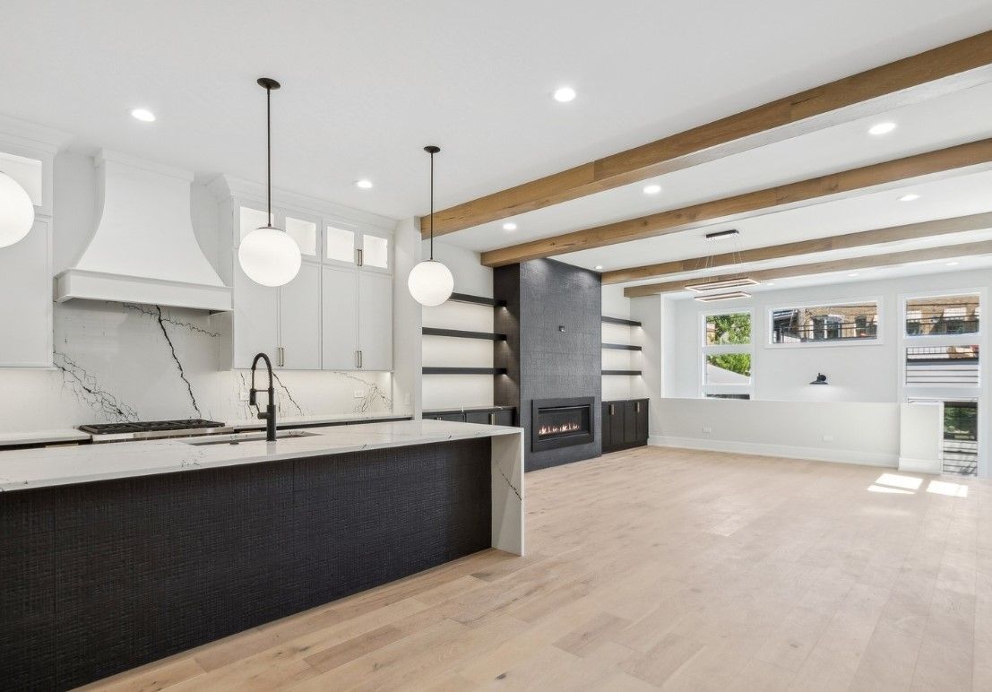 A kitchen with a large island in the middle of the room.