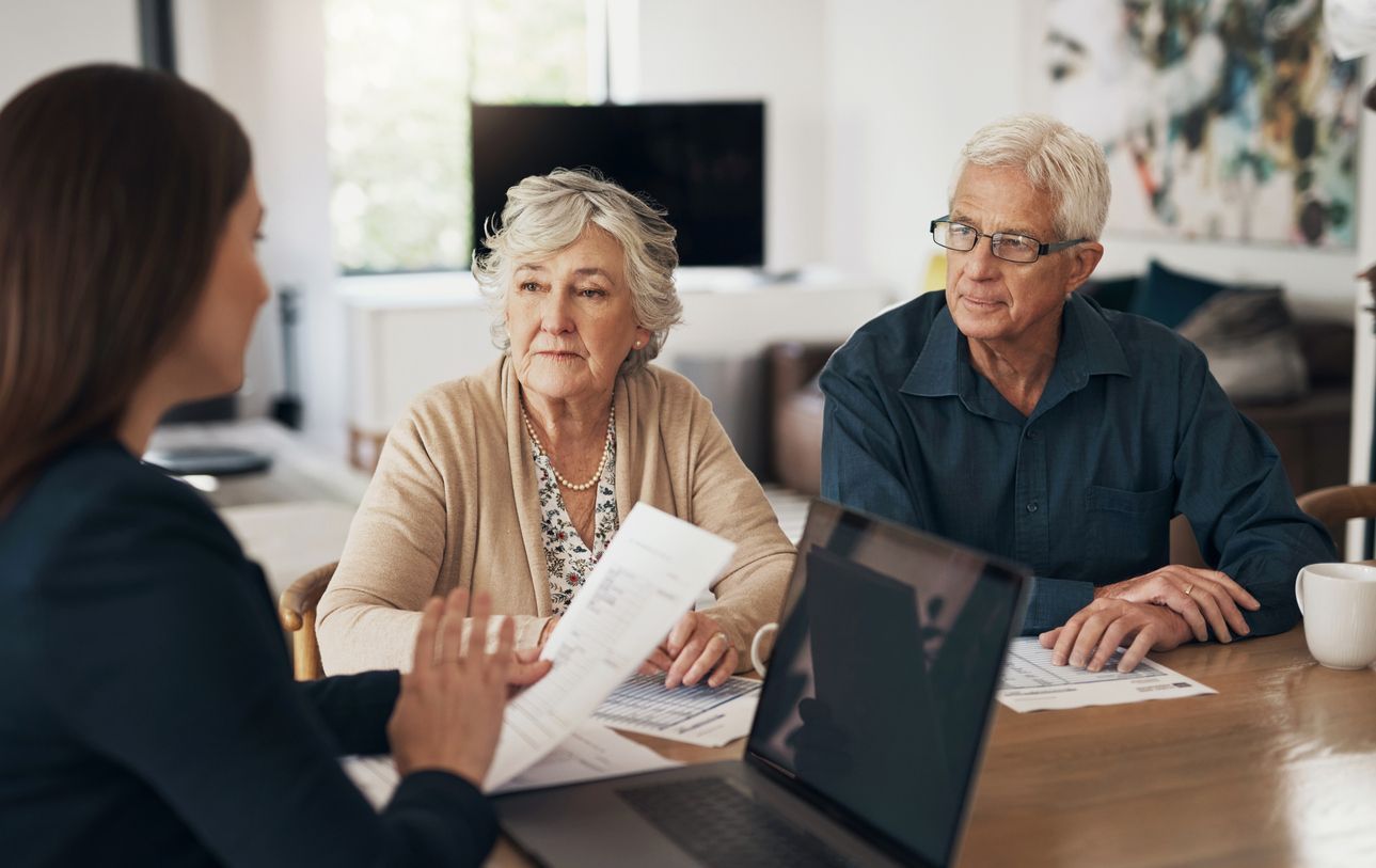 elderly couple meeting with a woman