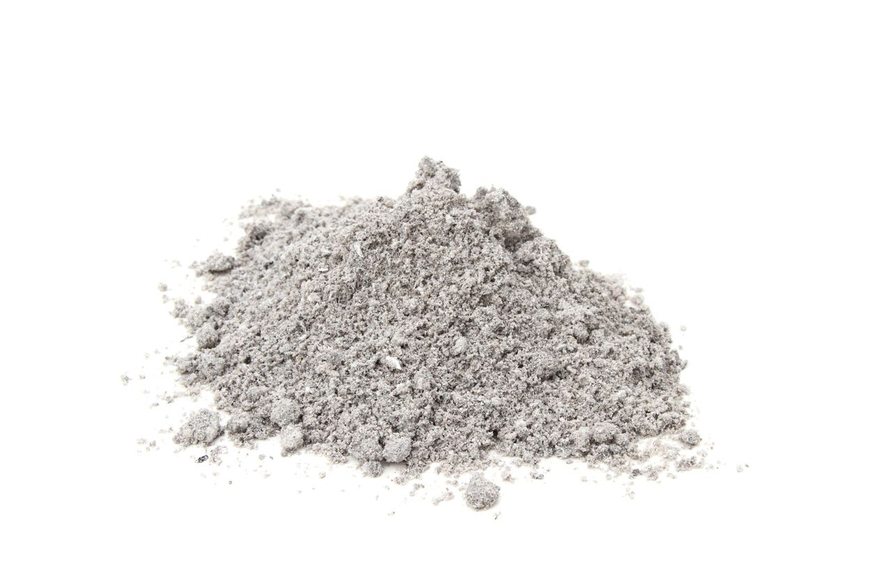 cremated ashes in a pile on a white background