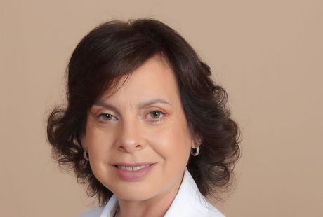 Headshot of Doctor Nazario with dark hair, wearing a white collared shirt