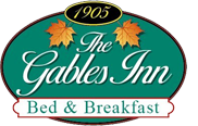 Logo for The Gables Inn Bed & Breakfast, with green oval and 1905 date. Features maple leaves and script text.