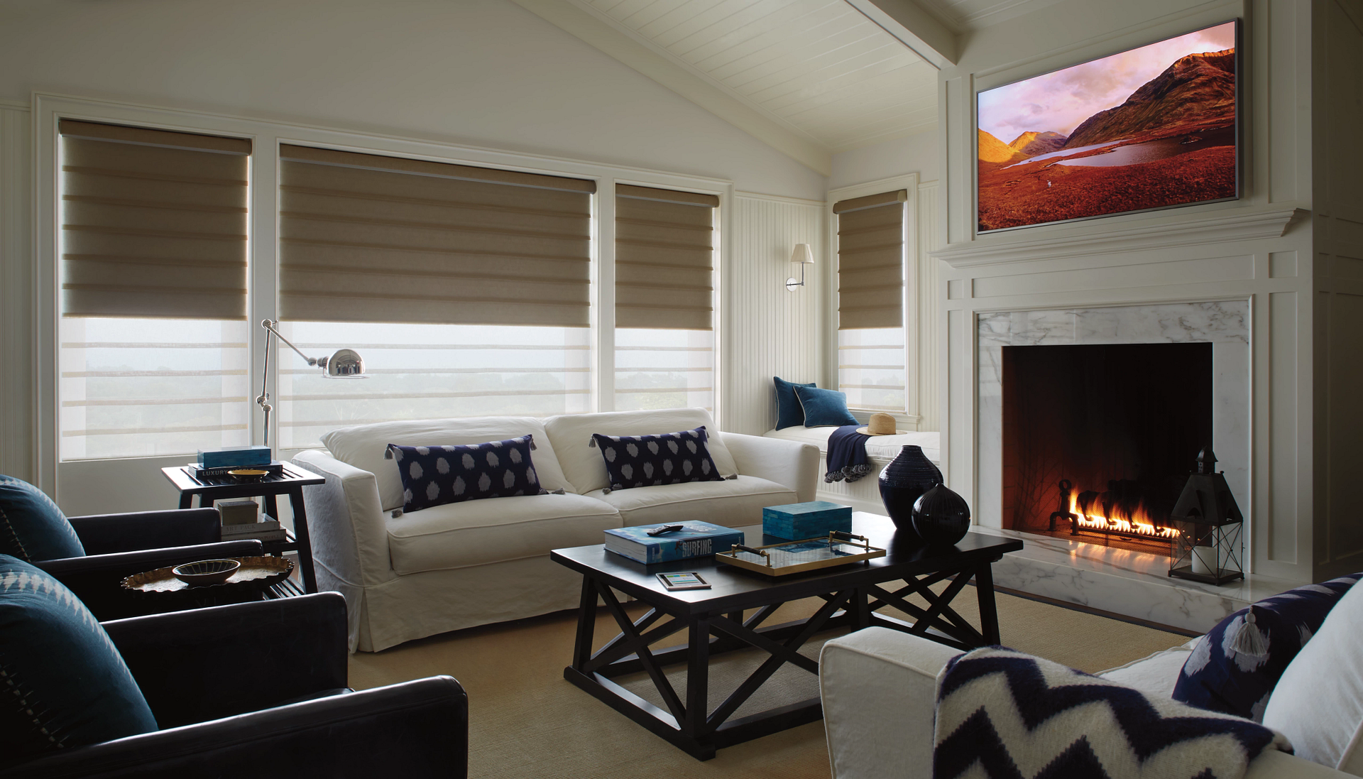 Hunter Douglas Vignette® Roman Shades covering living room windows.