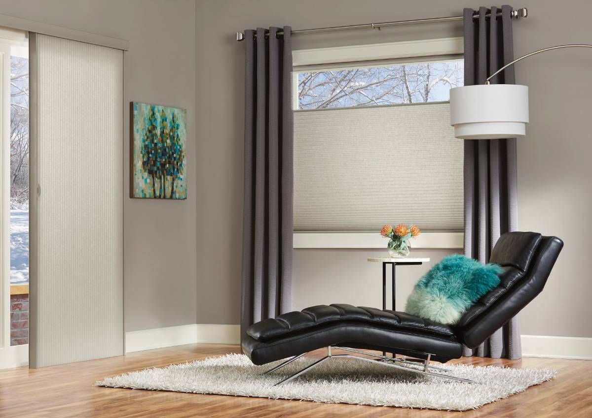 Hunter Douglas Duette® Cellular Shades insulating a living room window during winter