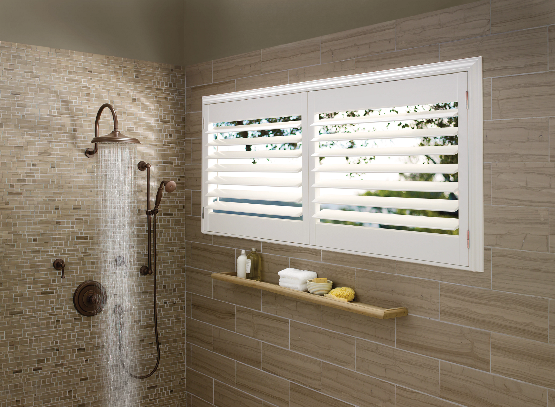 Shower with Hunter Douglas Palm Beach™ Polysatin® Shutters covering a window.