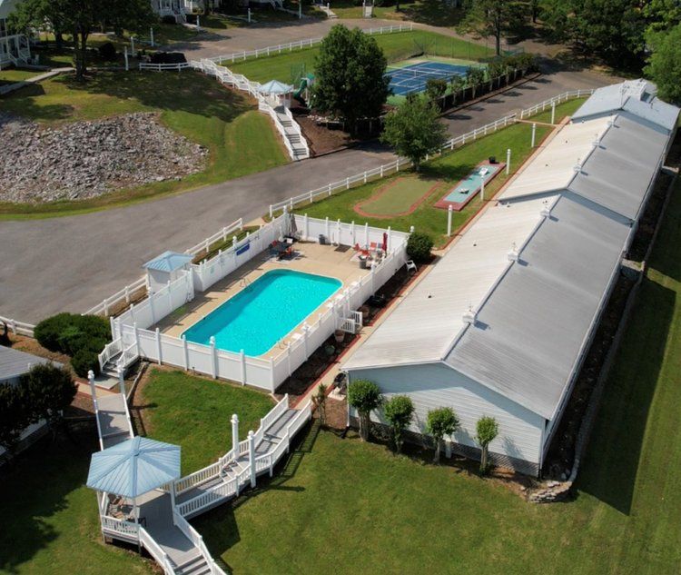 an aerial view of a swimming pool surrounded by buildings